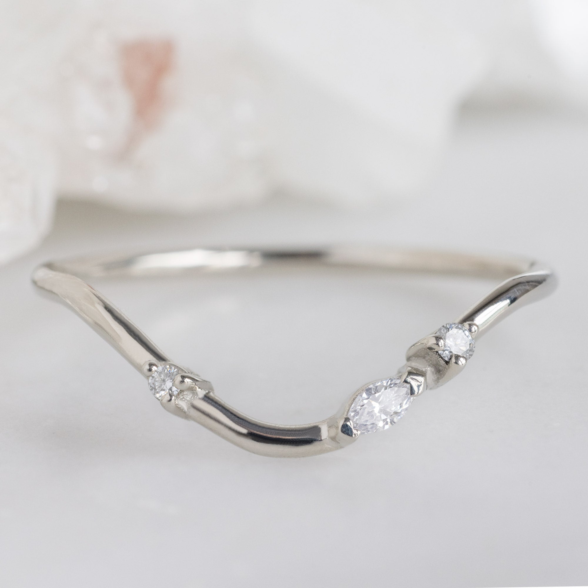 Asymmetrical Marquise Diamond Arc Stacking Band in 14K White Gold on White Marble
