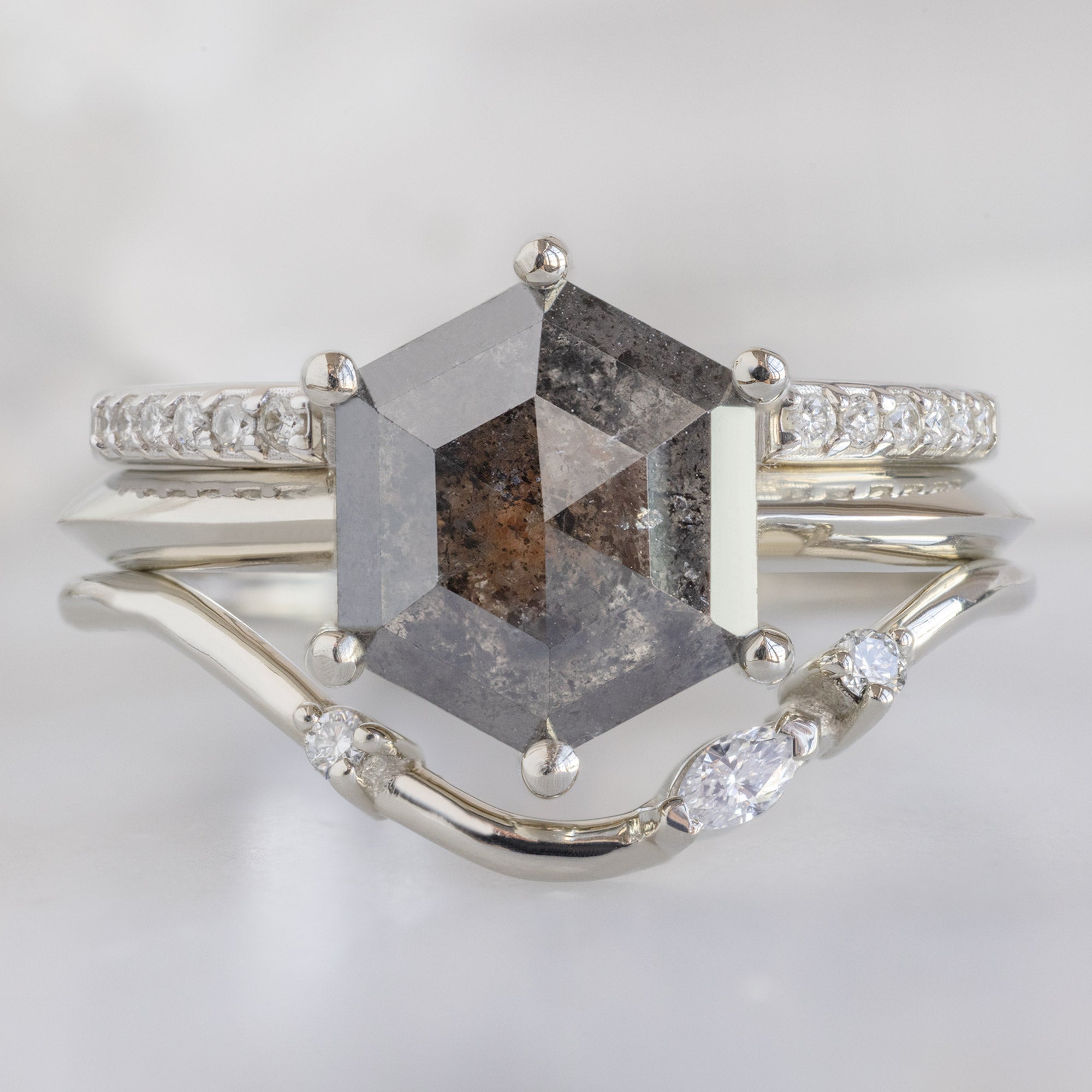 Asymmetrical Marquise Diamond Arc Stacking Band in 14K White Gold Stacked with a Black Hexagonal Diamond Engagement Ring