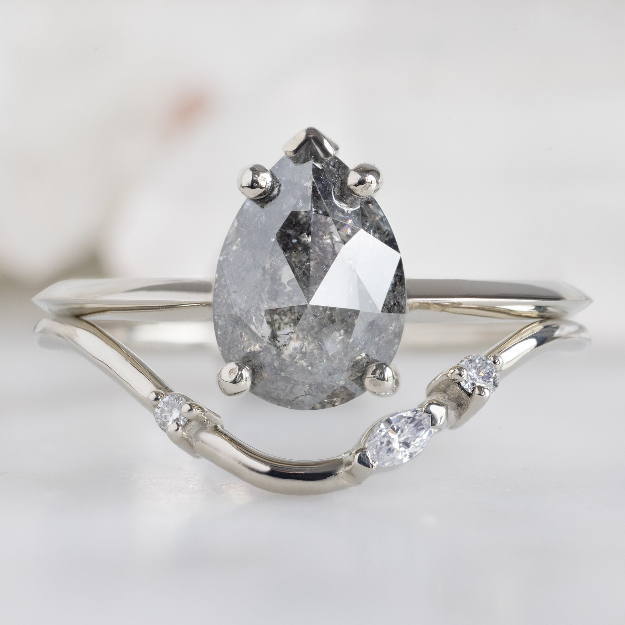 Asymmetrical Marquise Diamond Arc Stacking Band in 14K White Gold Stacked with a Black Pear Shaped Diamond Engagement Ring