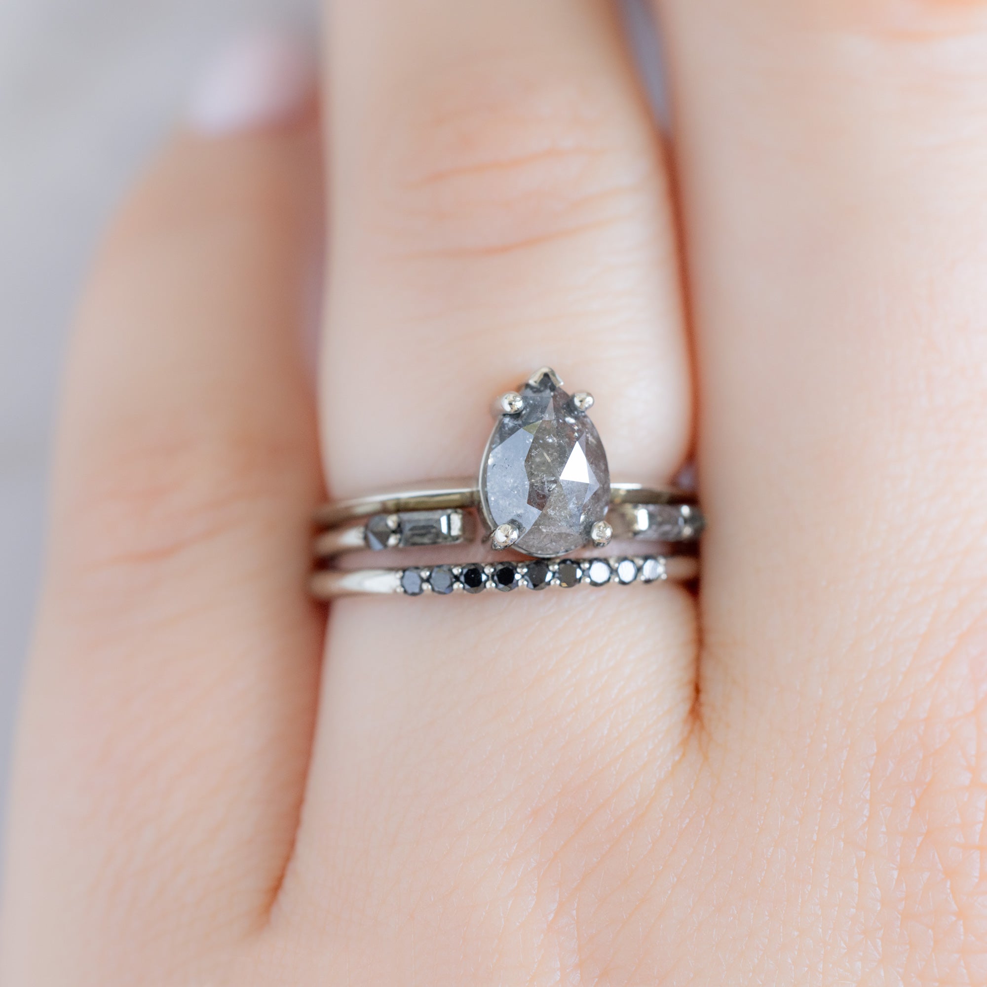 The Luxe Black Diamond Pavé Wedding Band in 14K White Gold Stacked with Salt and Pepper Diamond Engagement Ring on Model