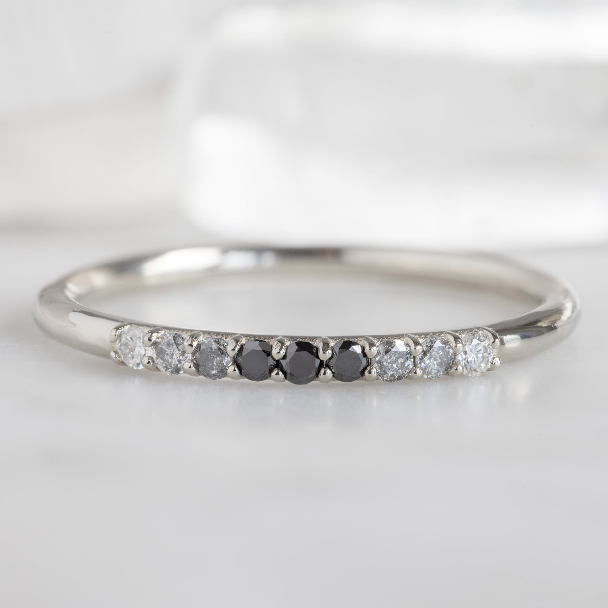 The Luxe Ombré Diamond Pavé Wedding Band in 14K White Gold on White Marble