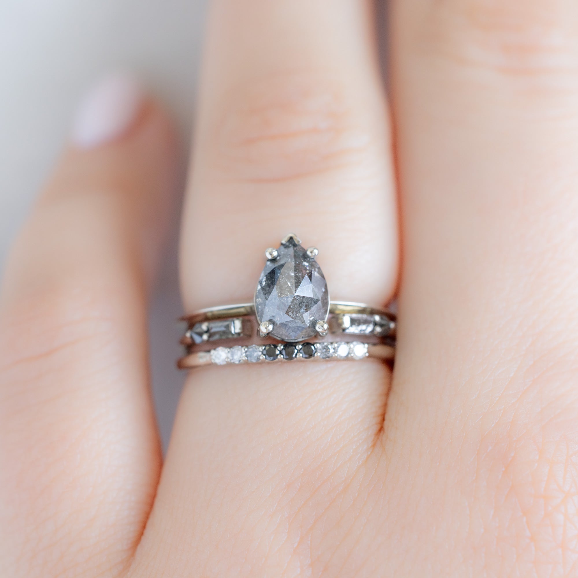 The Luxe Ombré Diamond Pavé Wedding Band in 14K White Gold Stacked with Salt and Pepper Diamond Engagement Ring on Model