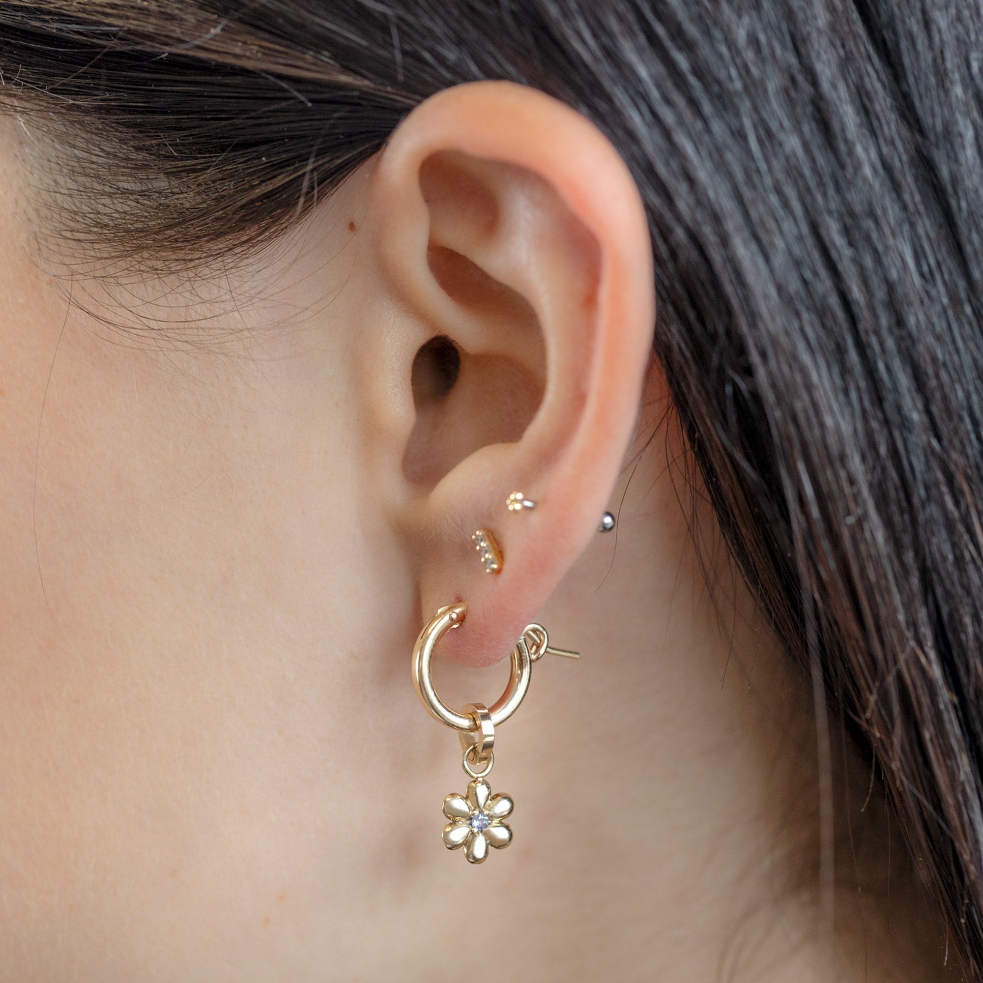 The Flower Power Charm in 10K Yellow Gold on Yellow Gold Charm Hoops on Model