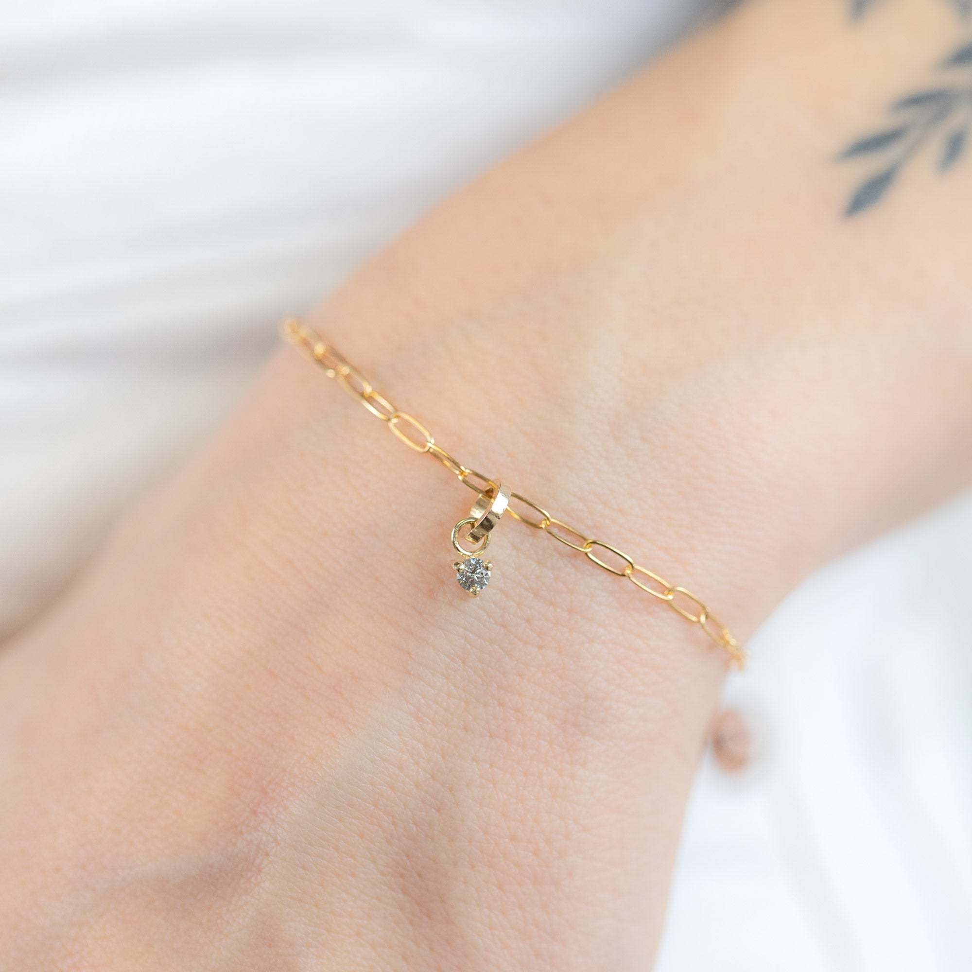 The Salt and Pepper Diamond Birthstone Charm in 10K Yellow Gold on Drawn Cable Chain Bracelet on Model