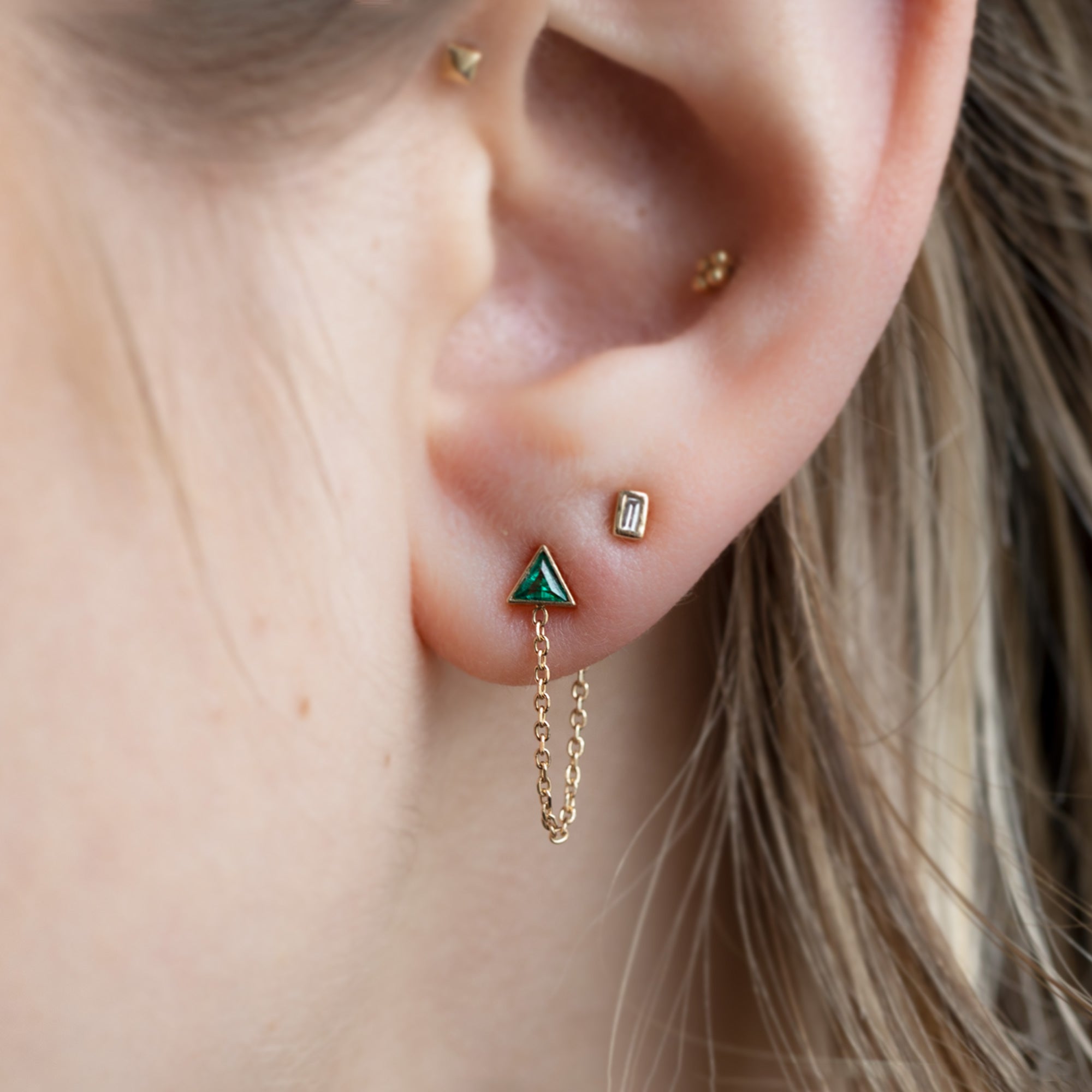 buy:the-white-diamond-baguette-stud-earrings-14k-yellow-gold,the-emerald-trillion-chain-hoop-earrings-14k-yellow-gold