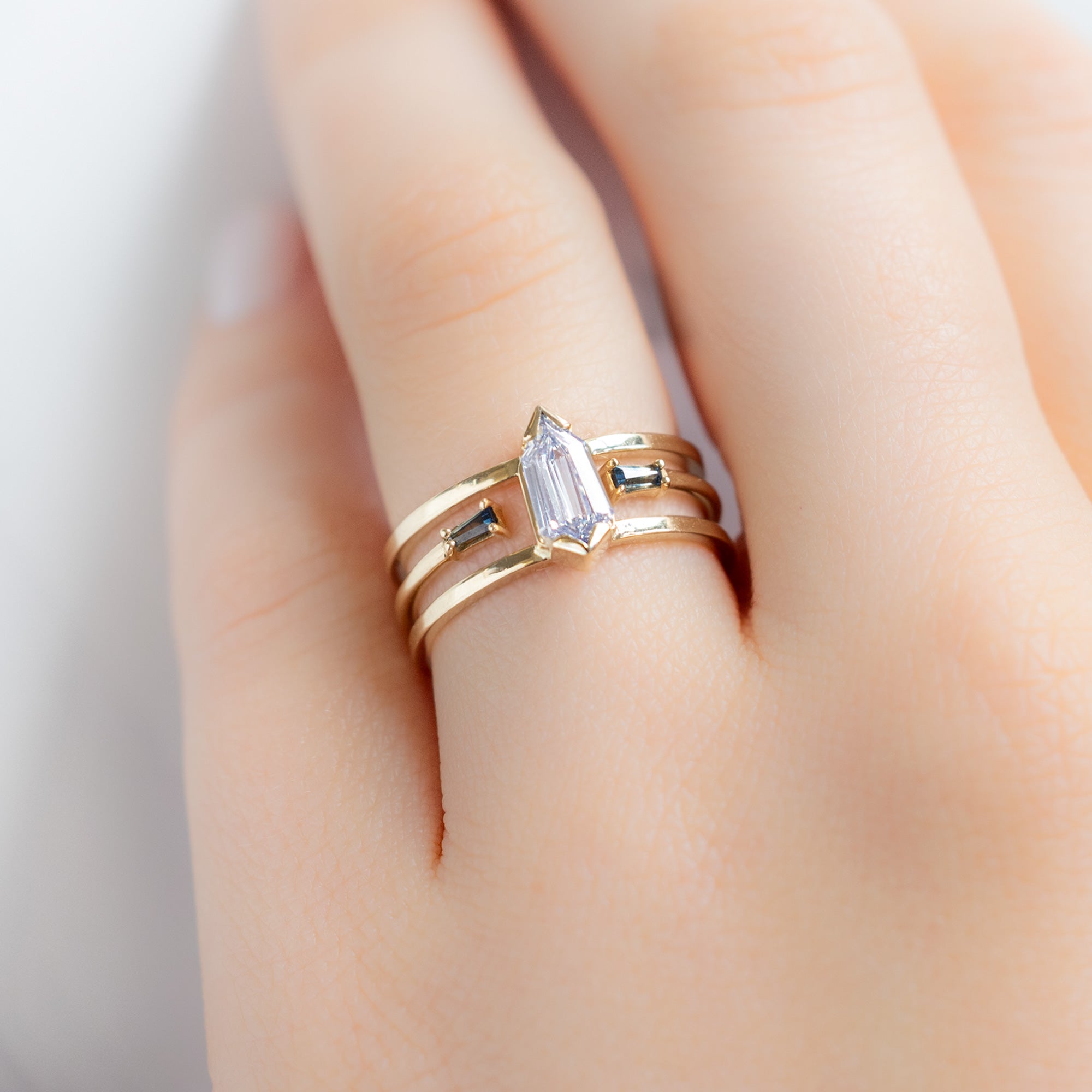 buy:the-poppy-ring-0-69ct-geometric-white-diamond-in-14k-yellow-gold,open-cuff-montana-sapphire-baguette-stacking-band-14k-or-18k-yellow-gold