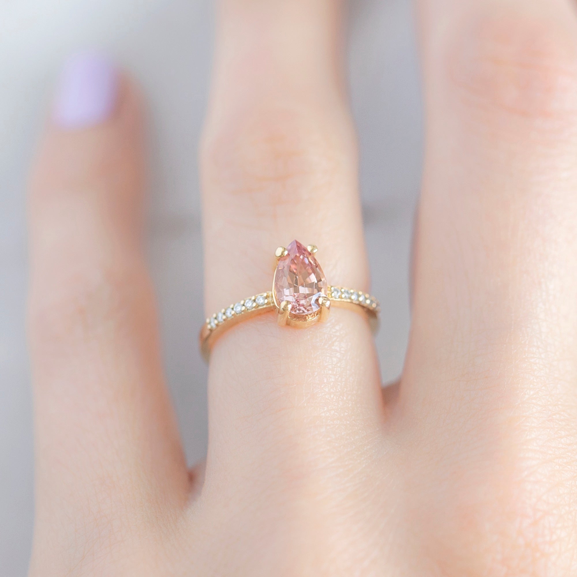 The Willow Ring with a 1.00ct Pear Garnet in 14K Yellow Gold on Model