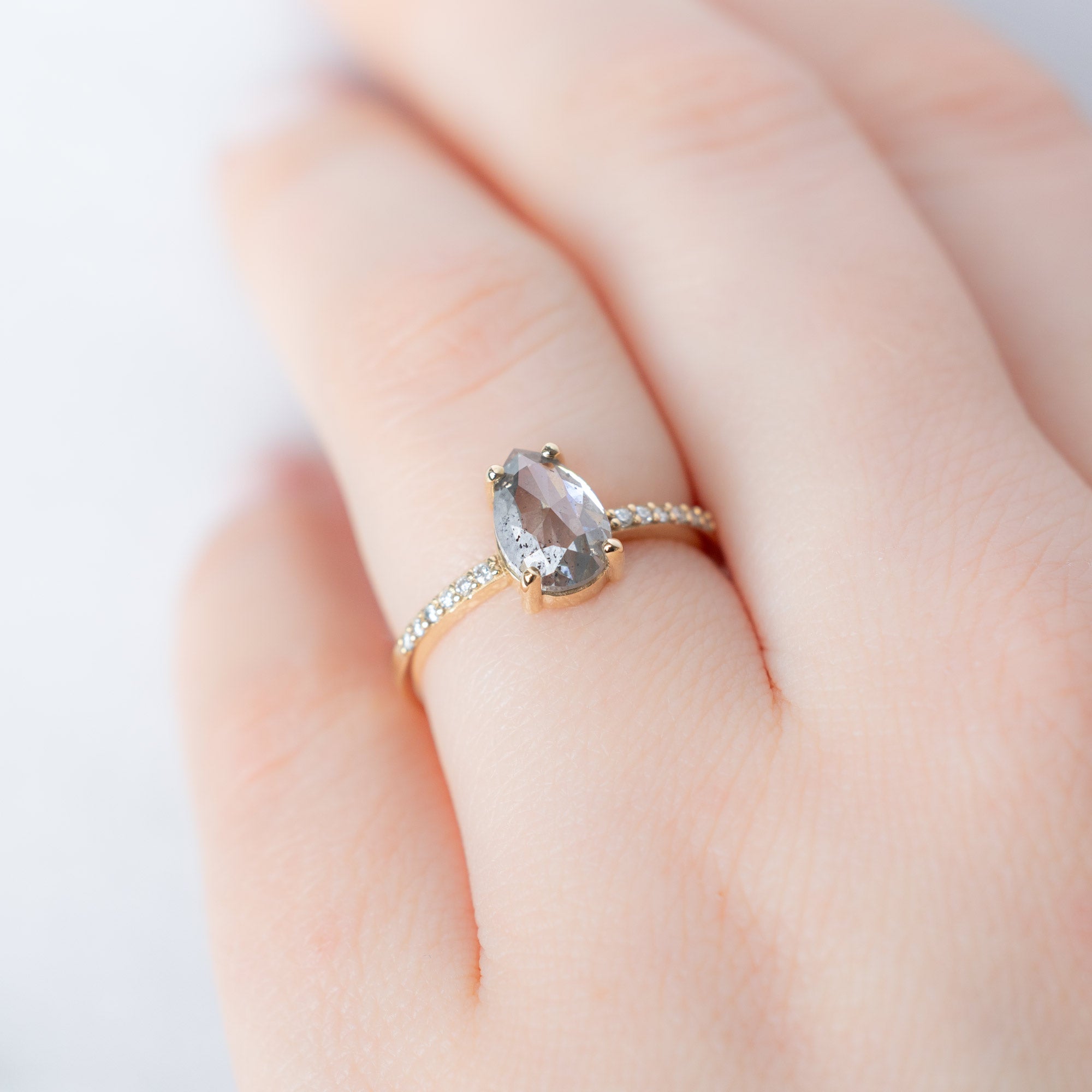 The Willow Ring with a 1.52ct Pear Salt and Pepper Diamond in 14K Yellow Gold on Model