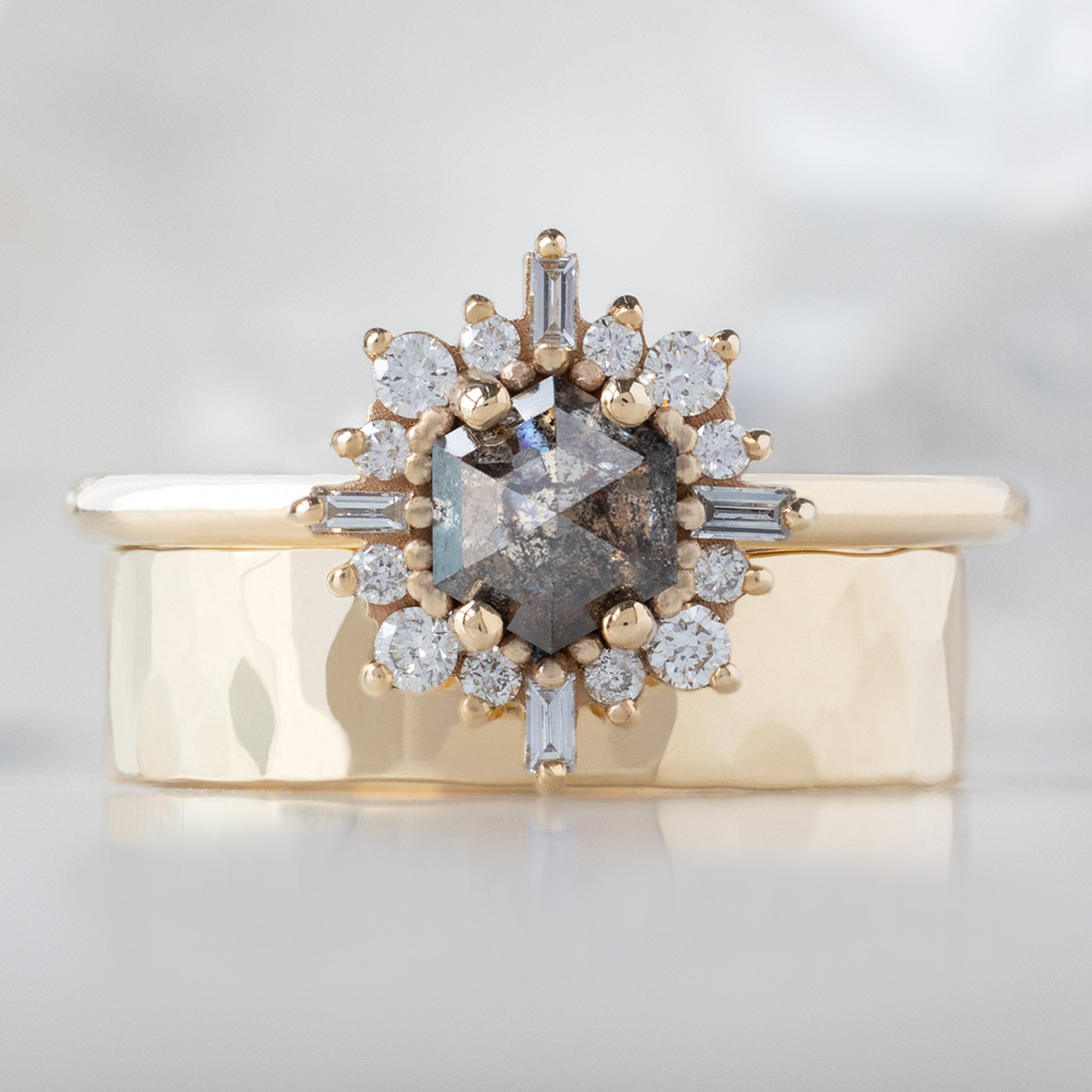 The Compass Ring with a Hexagon Salt and Pepper Diamond in 14K Yellow Gold Stacked with the Classic Gold Wedding Band