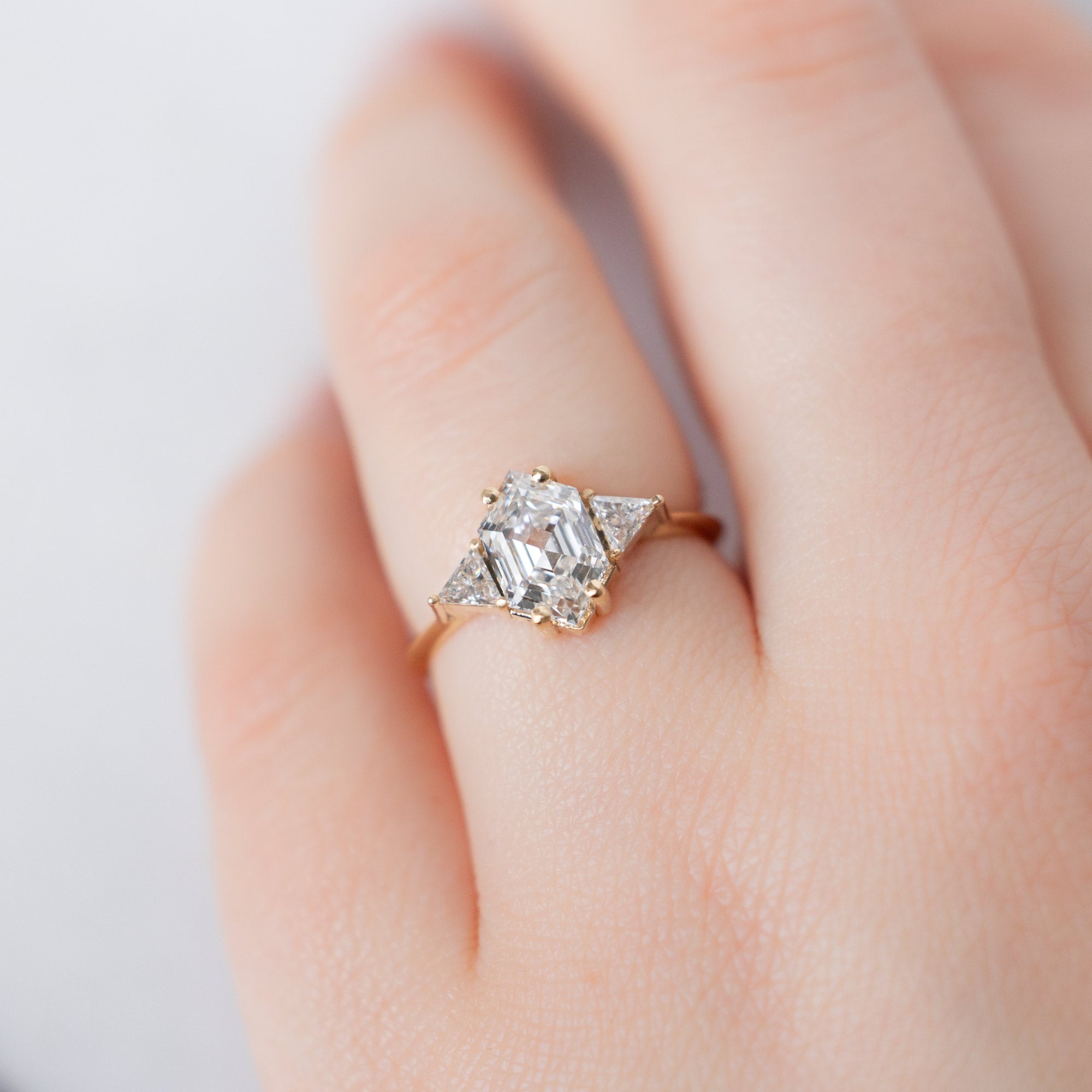 The Jade Ring with a Lab Grown White Hexagon Diamond in 14K Yellow Gold on Model