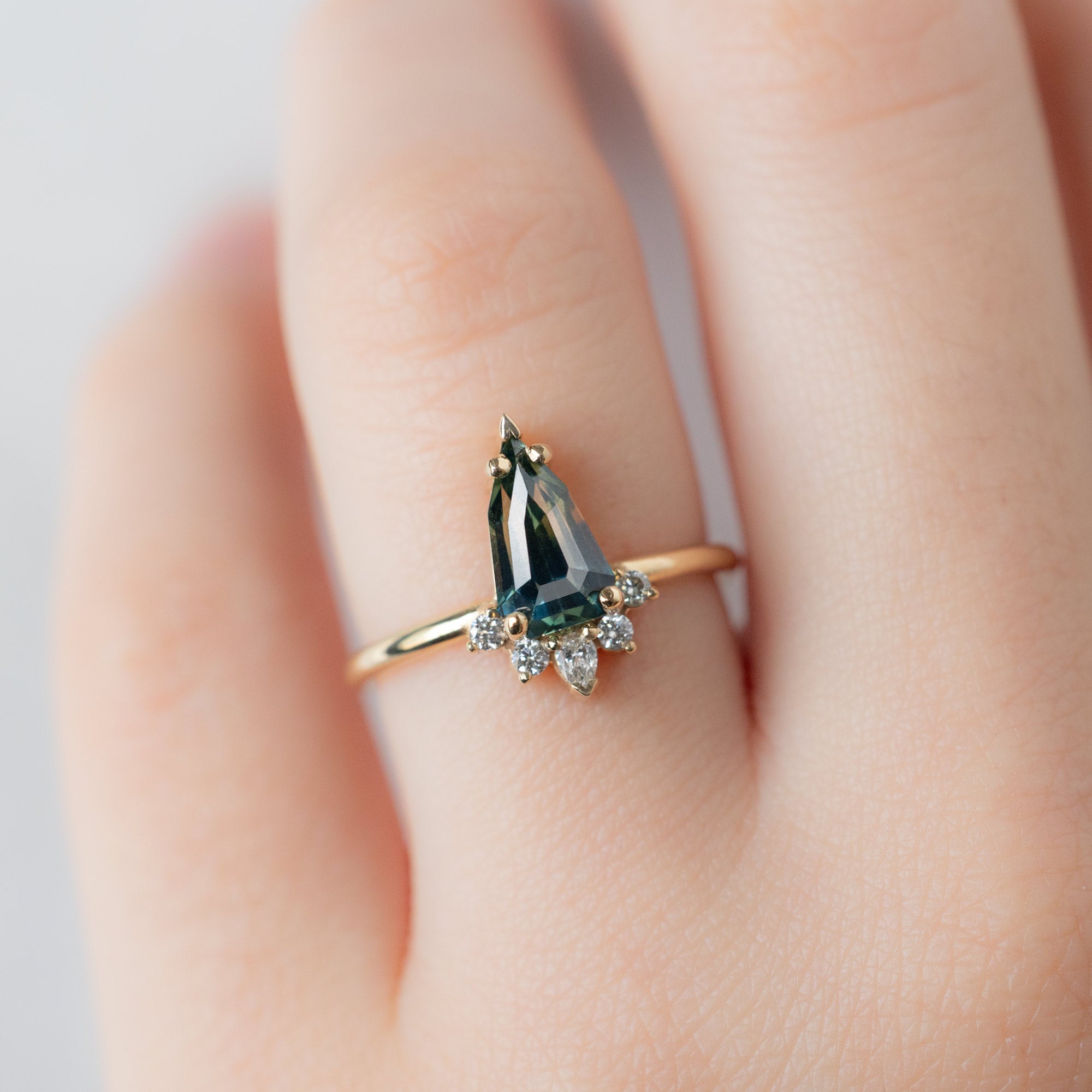 The Aster Ring with a 1.56ct Geometric Montana Parti Sapphire in 14K Yellow Gold on Model