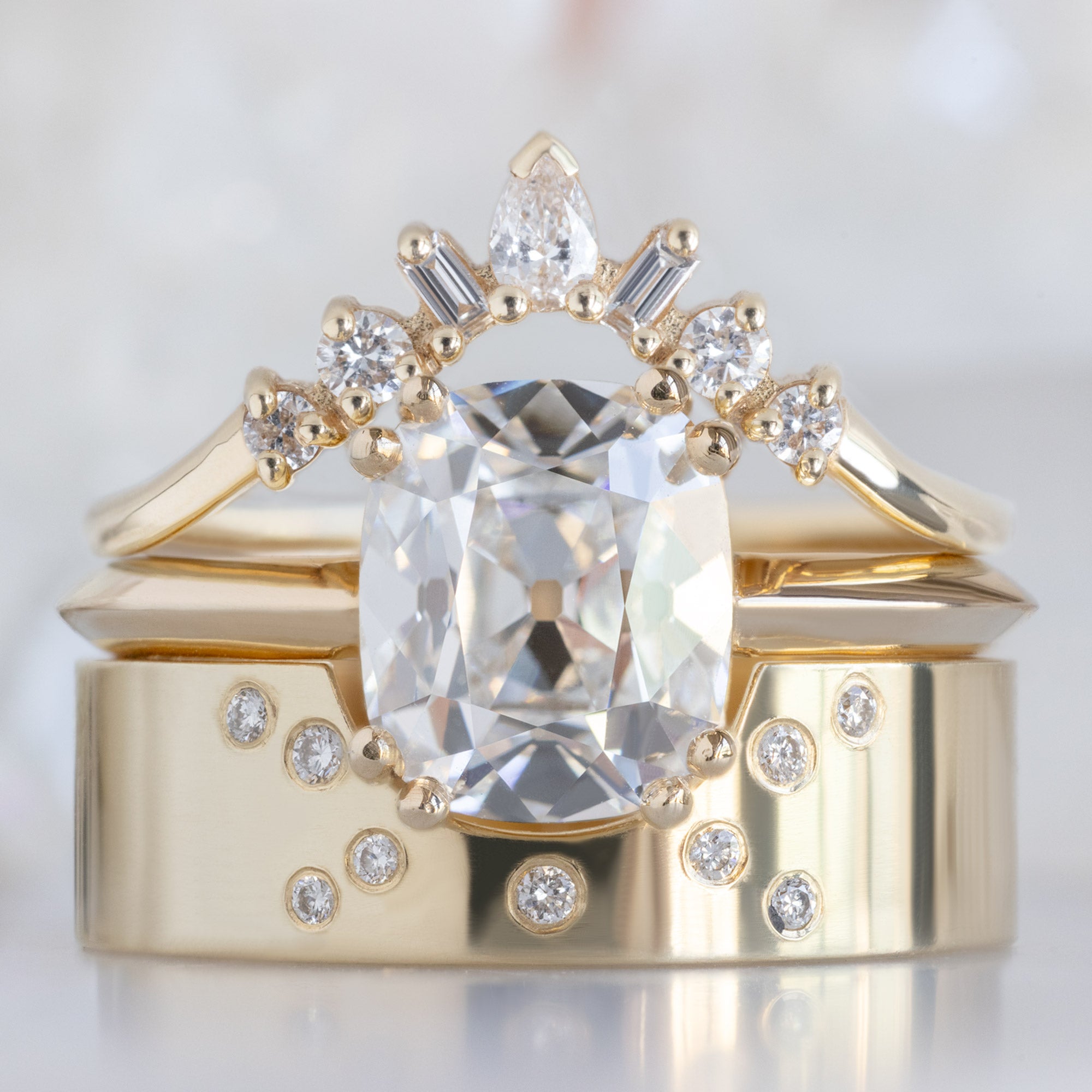 buy:geometric-white-diamond-sunburst-stacking-band-14k-or-18k-yellow-gold,the-bryn-ring-2-04ct-old-mine-cut-lab-grown-white-diamond-in-14k-yellow-gold,constellation-cut-out-stacking-band-arc-cut-out-in-14k-yellow-gold