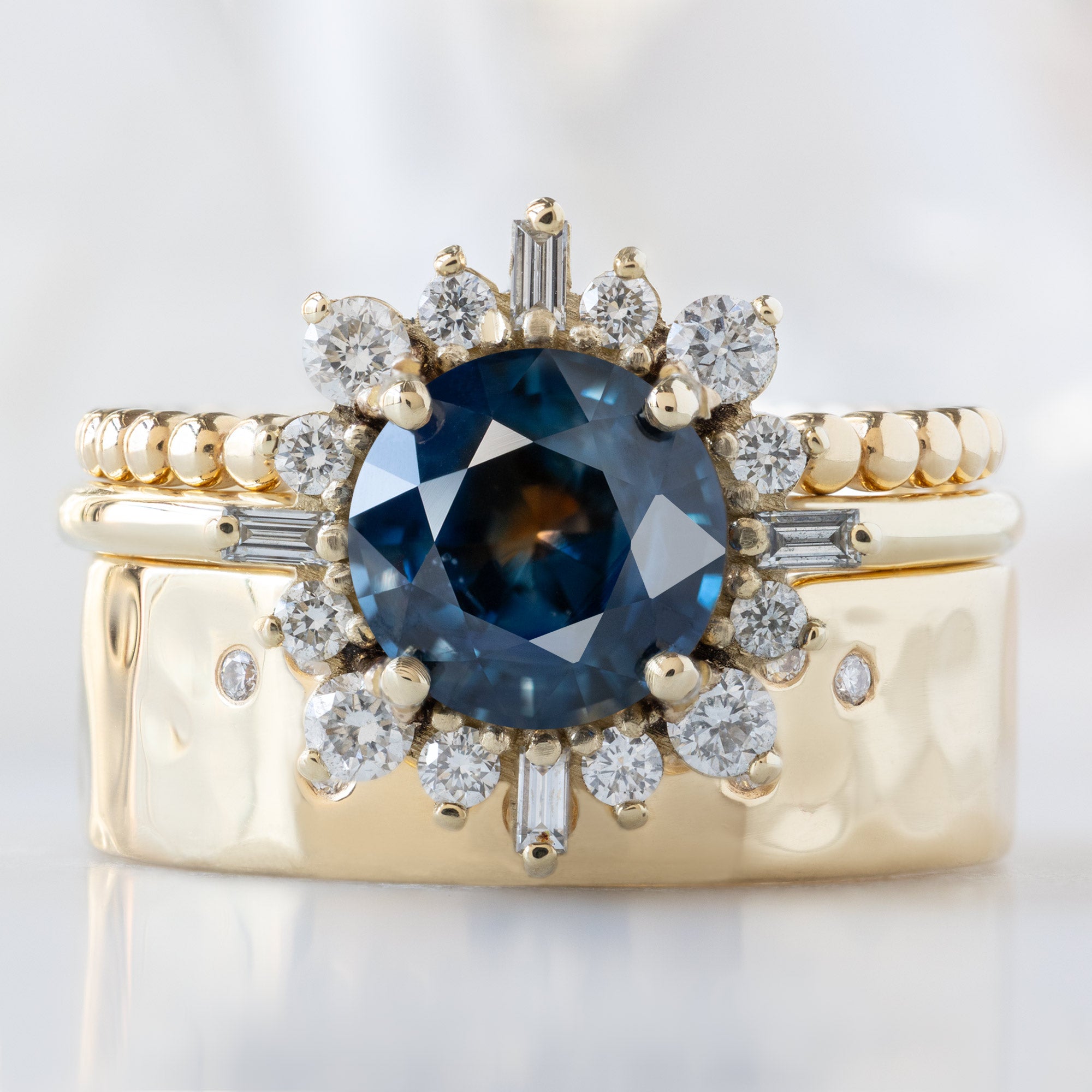 buy:the-gold-beaded-stacking-ring-14k-yellow-gold,the-compass-ring-1-61ct-round-bicolor-montana-sapphire-in-14k-yellow-gold,constellation-cut-out-stacking-band-arc-cut-out-in-14k-yellow-gold