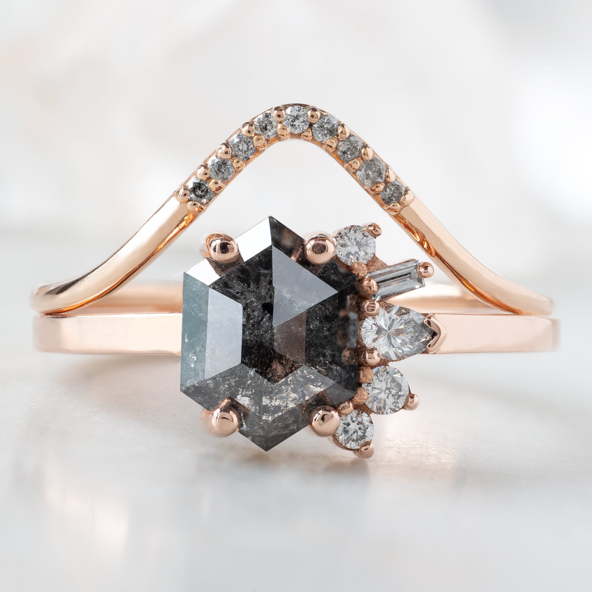 The Cluster Ring with a 1.07ct Hexagon Black Diamond in 14K Rose Gold Stacked with the Salt and Pepper Pavé Diamond Peak Stacking Band