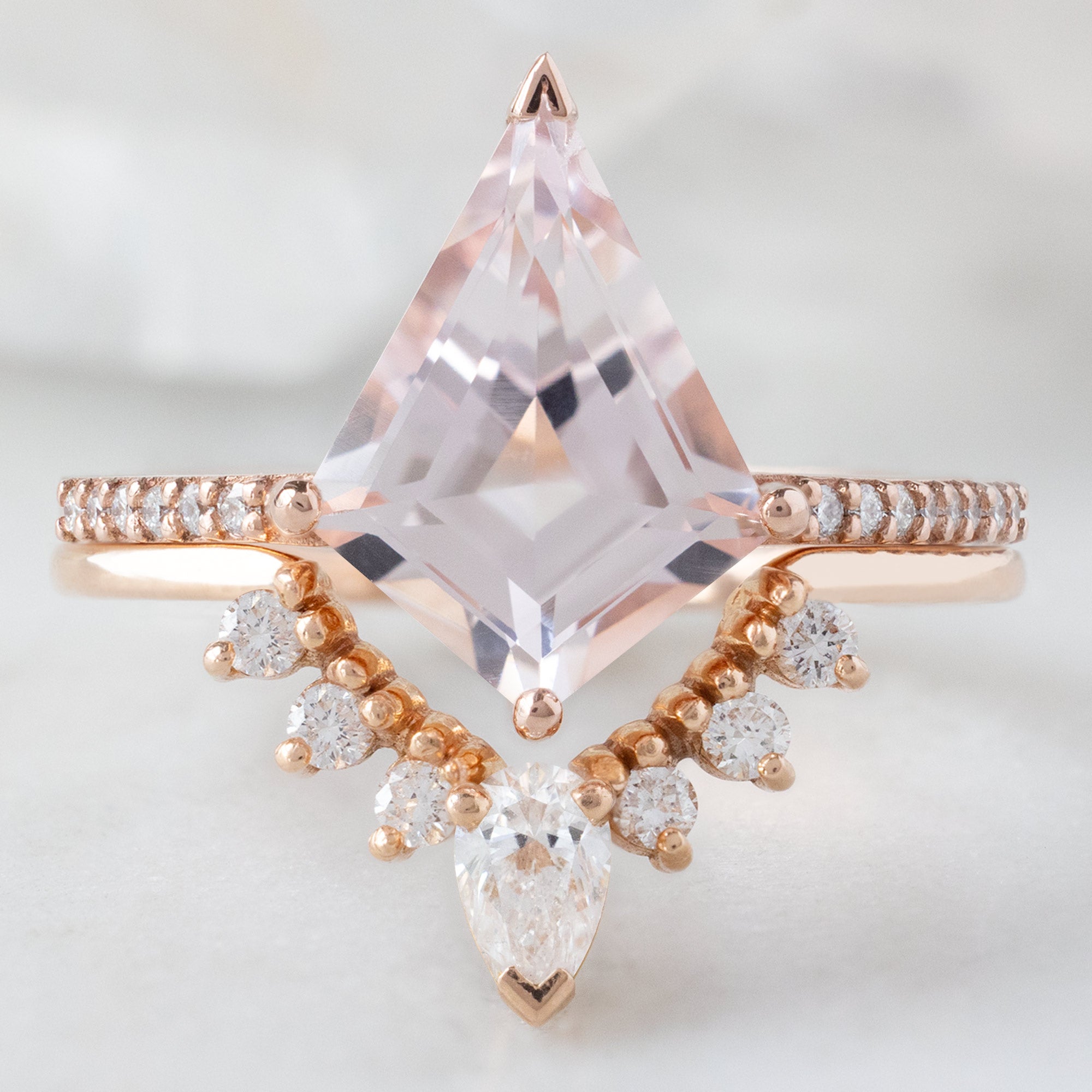 The Willow Ring with a 2.31ct Kite Morganite in 14K Rose Gold Stacked with the White Diamond Sunburst Stacking Band