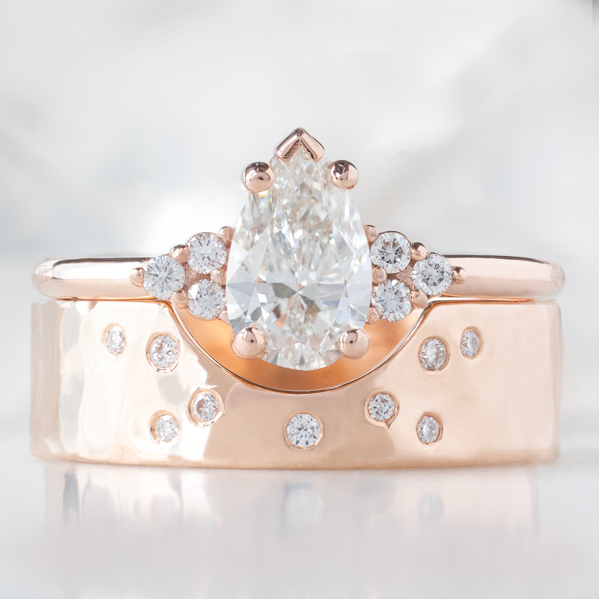 The Ivy Ring with a 0.65ct Pear White Diamond in 14K Rose Gold  Stacked with the Constellation Cut-Out Stacking Band