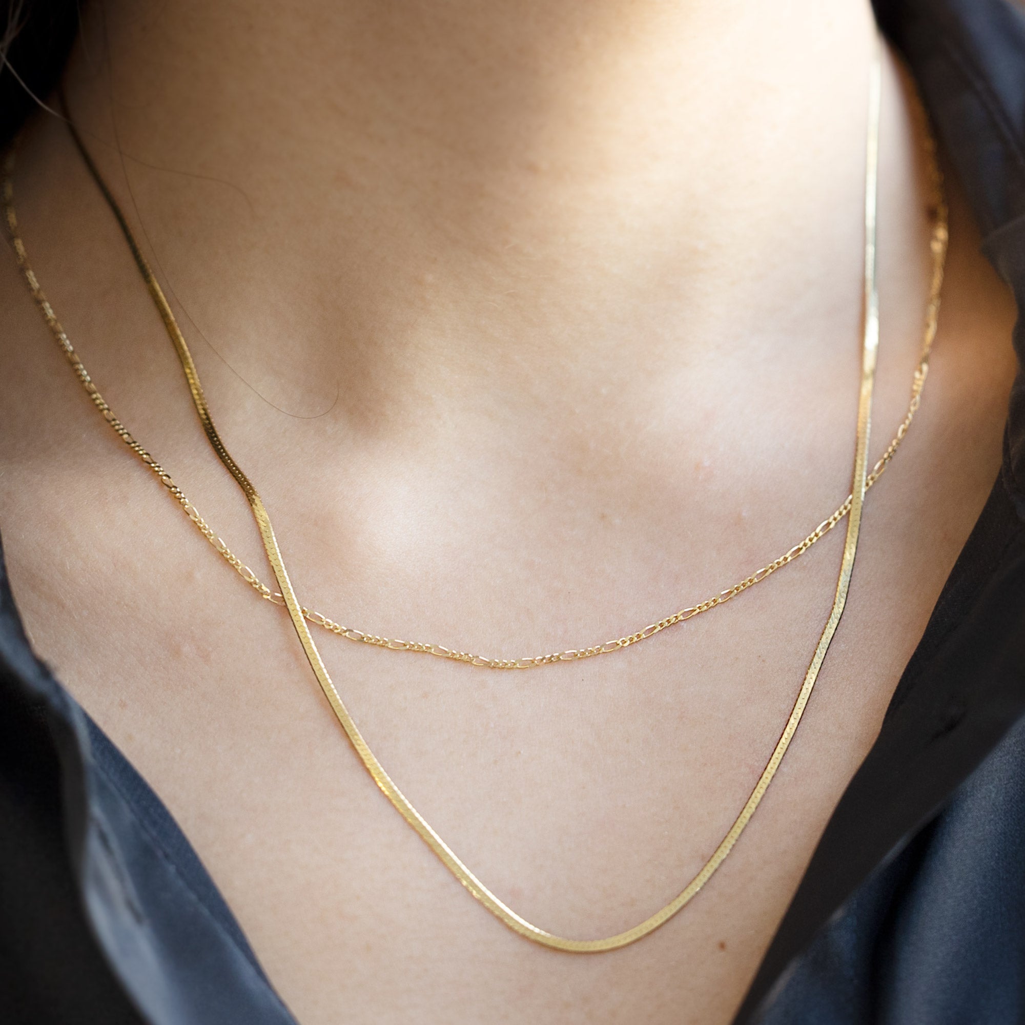 buy:the-herringbone-chain-necklace-14k-yellow-gold,the-figaro-chain-necklace-14k-yellow-gold