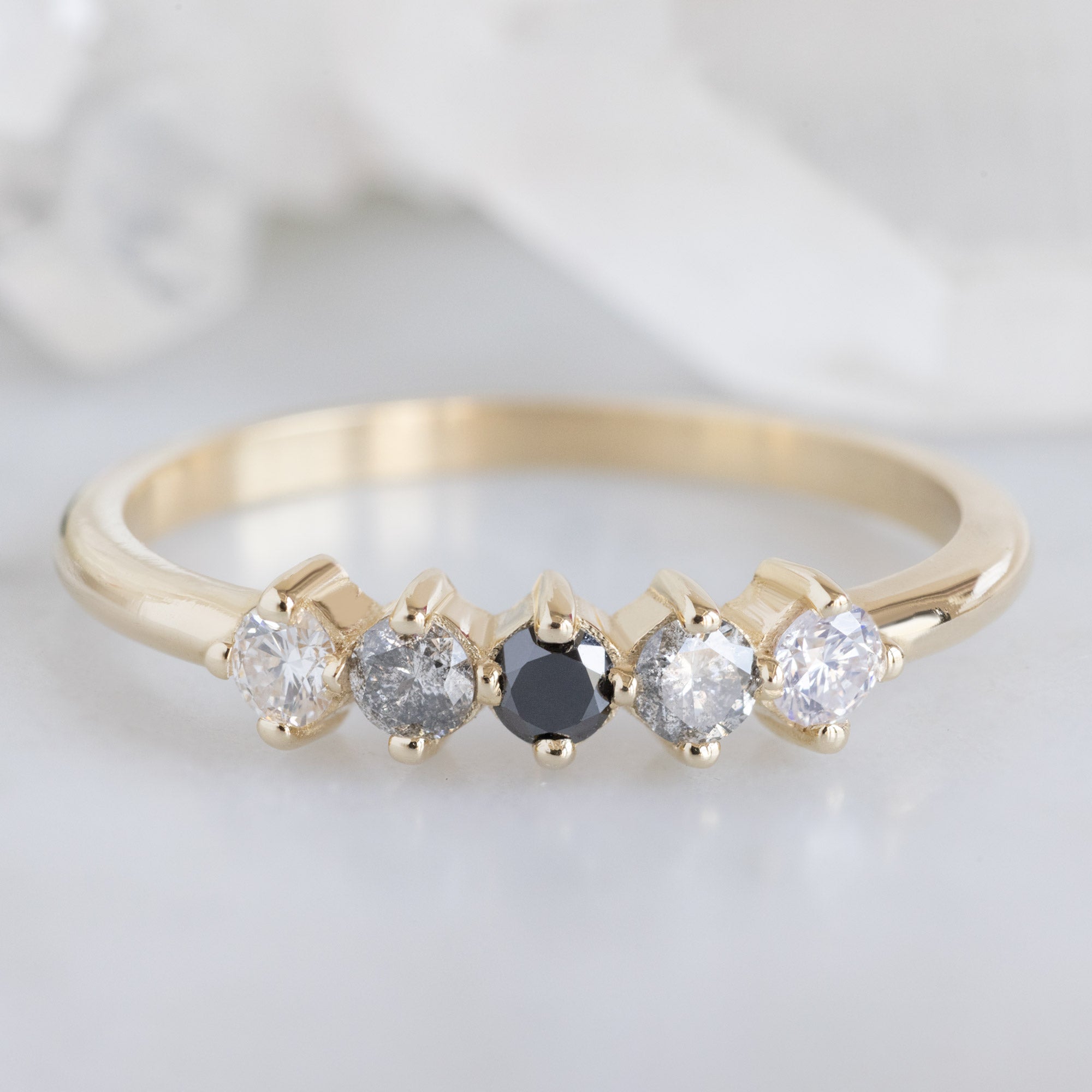 The Sequent Ombré Diamond Wedding Band in 14K Yellow Gold on White Marble