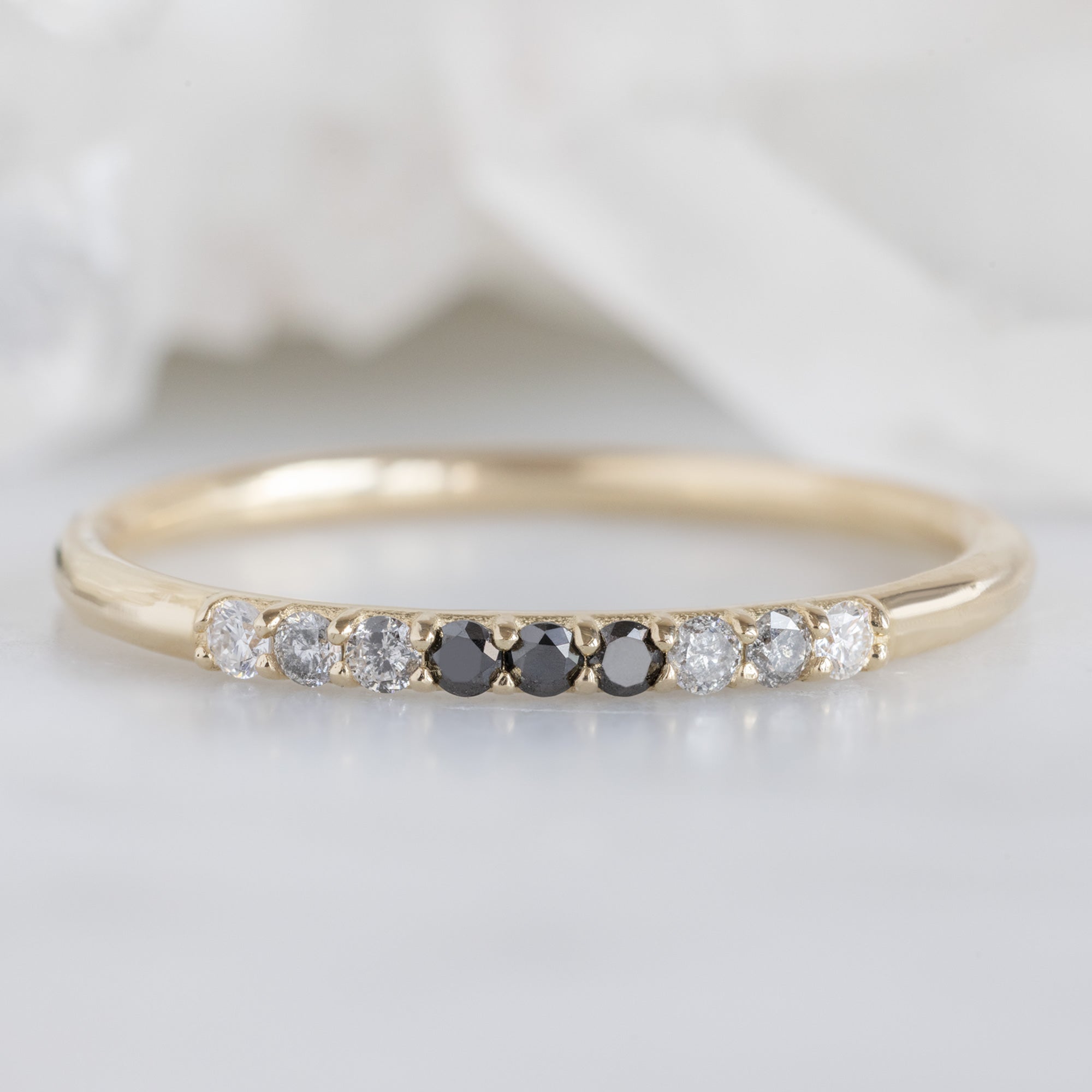 The Luxe Ombré Diamond Pavé Wedding Band in 14K Yellow Gold on White Marble