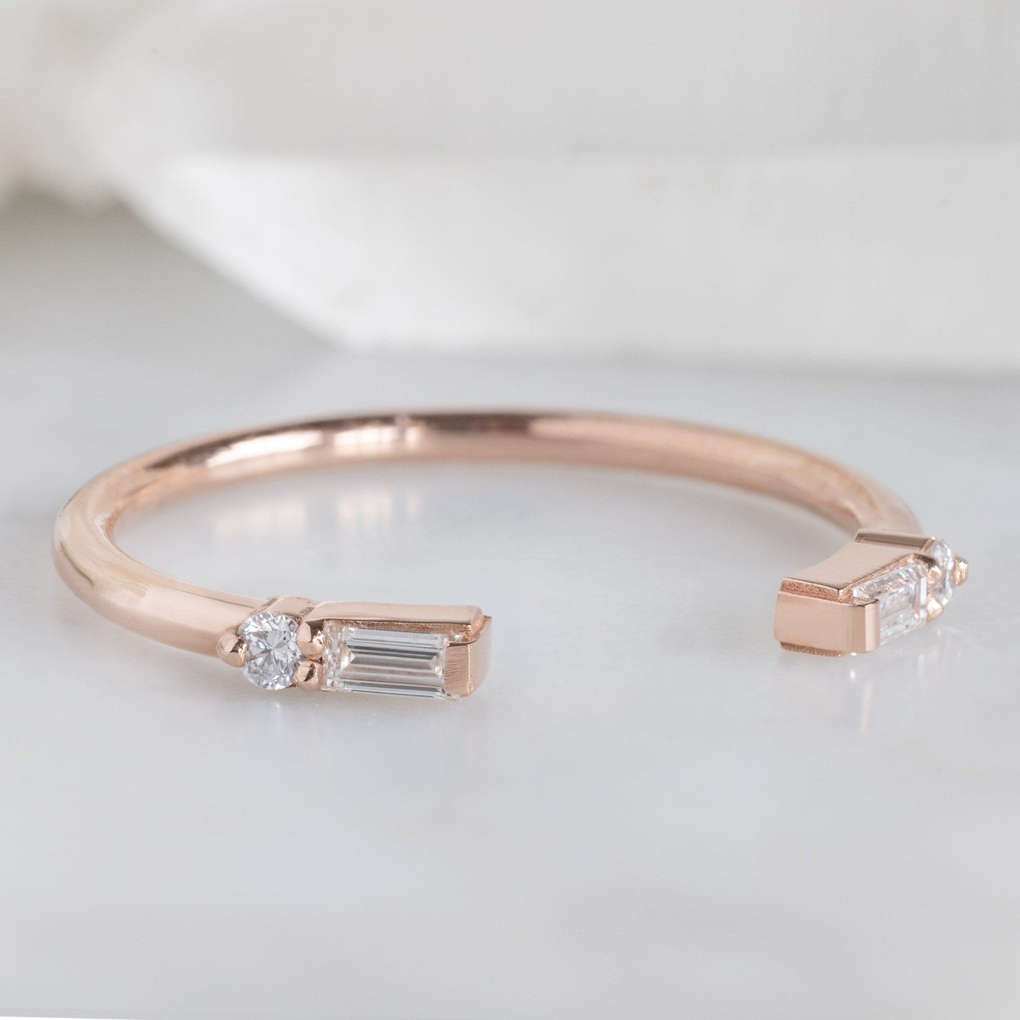 The Luxe Open Cuff White Baguette Diamond Stacking Band in 14K Rose Gold on White Marble