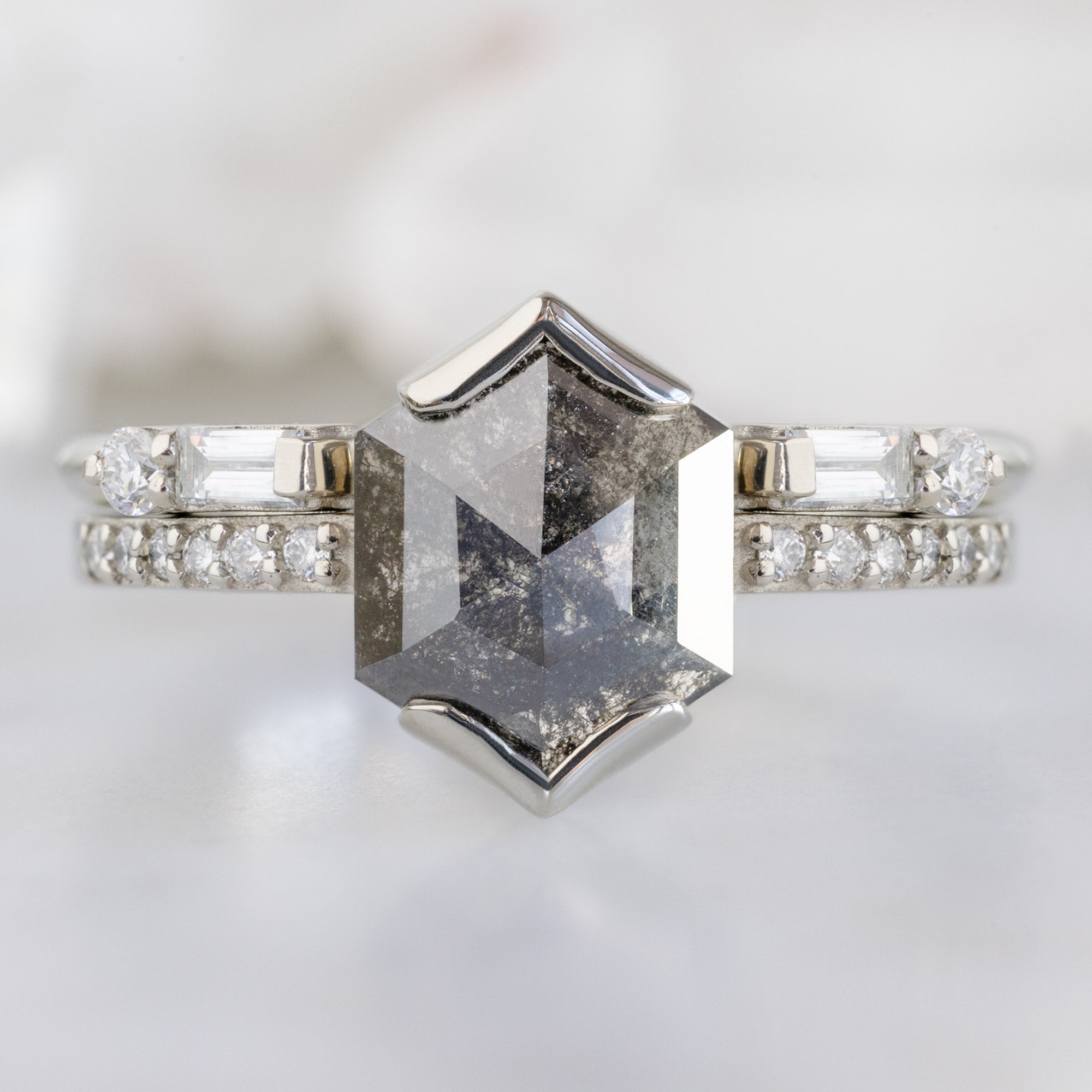 The Luxe Open Cuff White Baguette Diamond Stacking Band in 14K White Gold stacked with diamond engagement ring